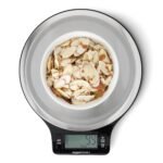 Amazon Basics Digital Kitchen Scale with LCD display on a wooden kitchen counter