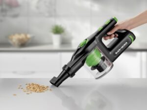 BLACK+DECKER Dustbuster AdvancedClean cordless handheld vacuum cleaning crumbs on a kitchen counter