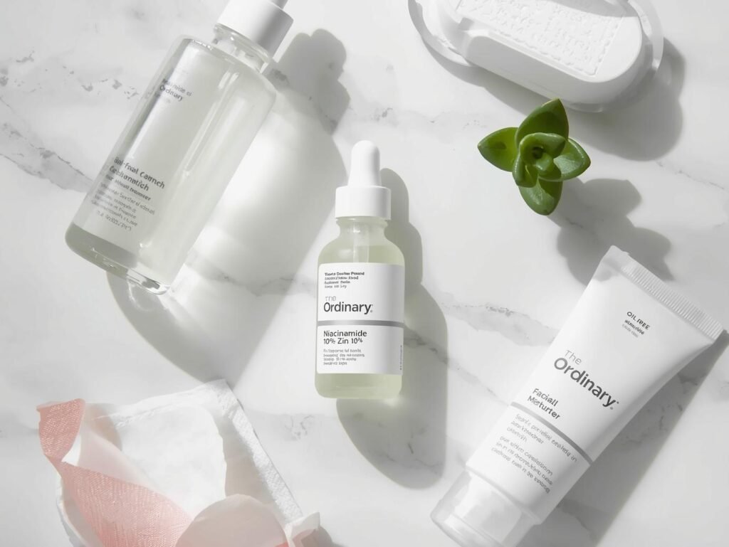 The Ordinary Niacinamide 10% + Zinc 1% serum bottle with dropper, shown on a clean skincare shelf with other minimalist beauty products